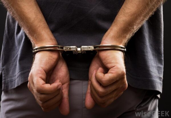 arrested in handcuffs scaled
