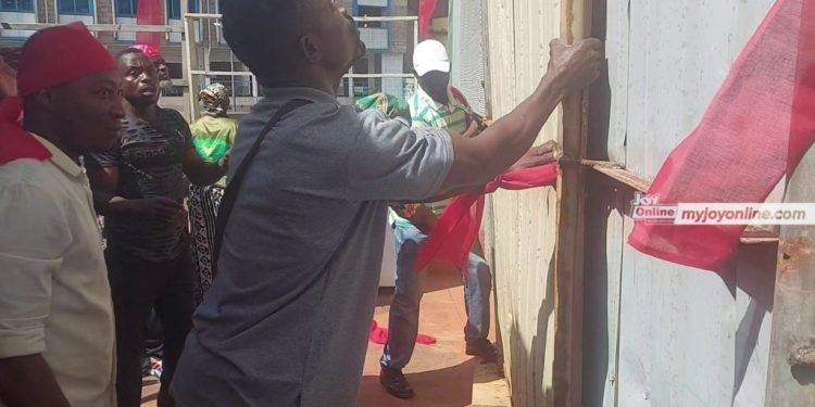shop owners at kejetia market protest closure