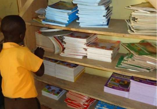 akuapem kyidomhene presents textbooks to schools