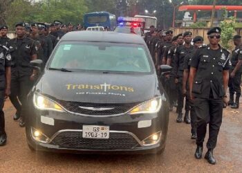 Solemn pre-burial service for slain police officer: promoted posthumously