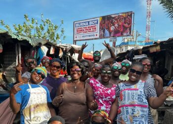 Burna Boy honours dancing Makola market women on billboard