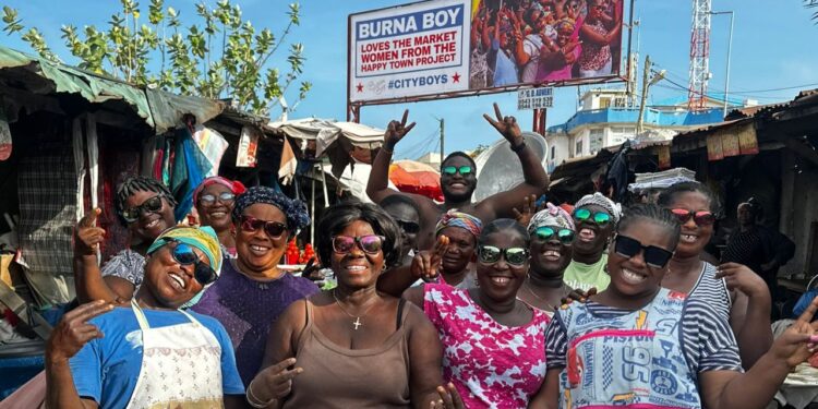 burna boy honours dancing makola market women on billboard