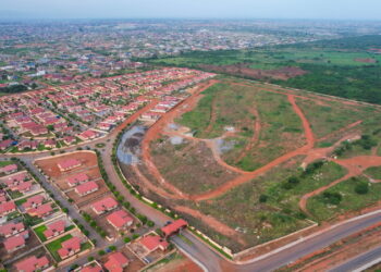 Regimanuel Gray outdoors Satellite City Project with17,000 homes in sight