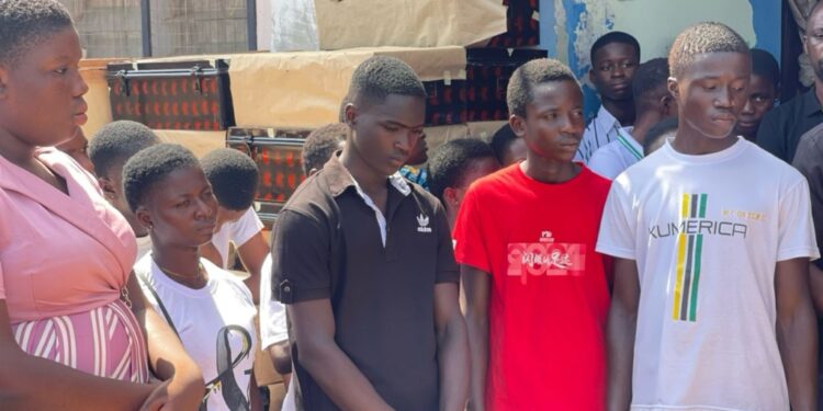 kumawu mp distributes trunks cash and others to 1st year shs students