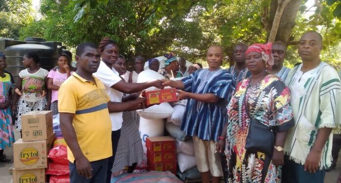 mepe mankralo present items to flood victims in north tongu