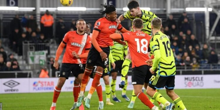 rice snatches arsenal win in seven goal luton thriller