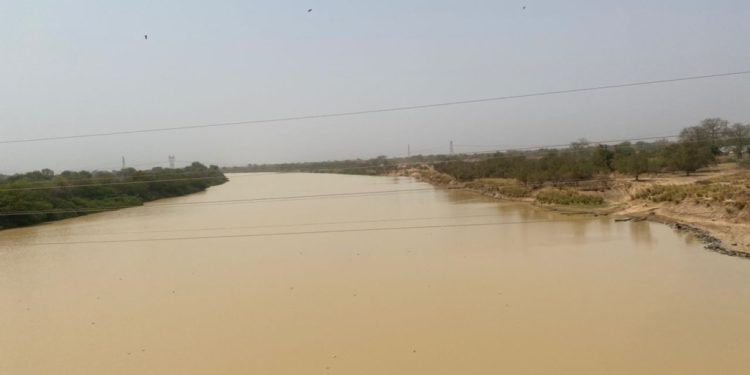 black volta river flowing near yapei polluted by illegal mining activities
