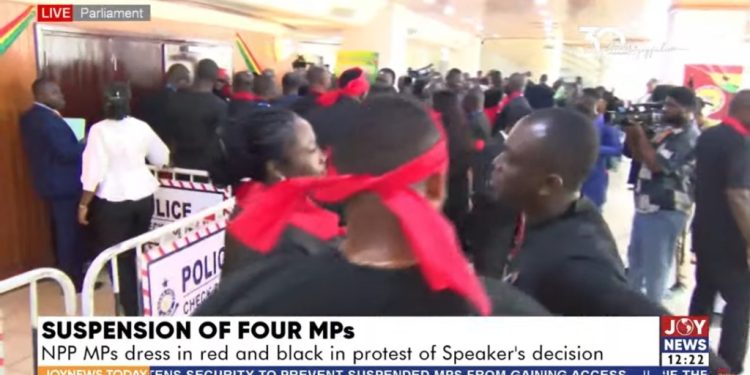 minority mps protest suspension of their colleagues in black and red