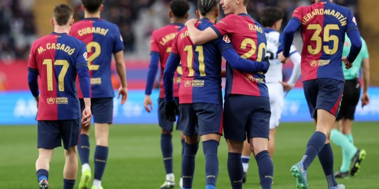 barcelona thrash 10 man real sociedad to go top of la liga