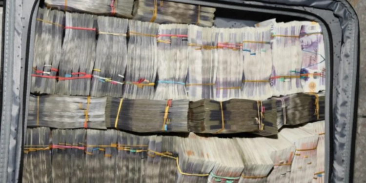 man arrested at heathrow airport over 400000 in suitcase