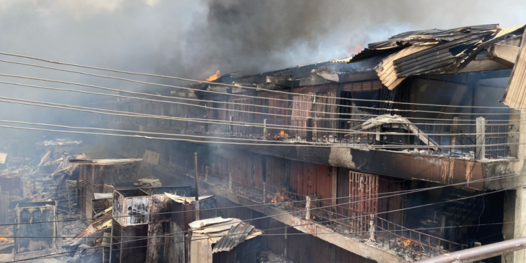 photos fire guts shops in 2 storey building at adum in kumasi