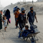 Thousands of Palestinians flee as Israeli troops push into Gaza City