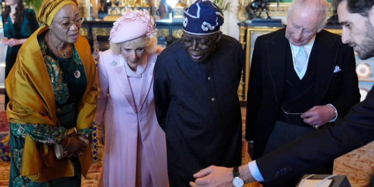 king charles greets nigerian president in windsor sunshine